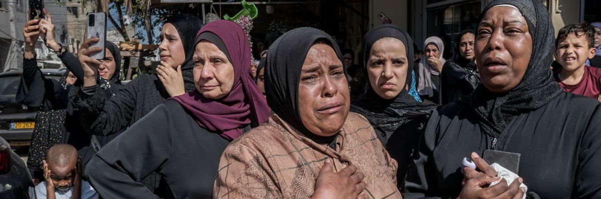 palestinian-women-cry-during-the-funeral-of-four-young-men.jpg