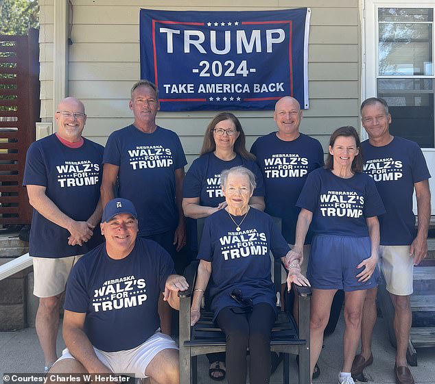 Eight members of Minnesota Gov. Tim Walz's family in Nebraska posing for an image showing their support for Republican rival Donald Trump