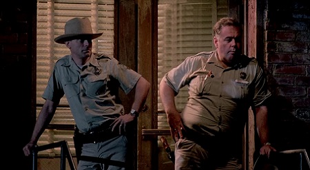 mississippi-burning-3-from-left-brad-dourif-as-deputy-sheriff-clinton-pell-based-on-cecil-price-and-gailard-sartain-as-ray-stuckey-sheriff-of-jessup-county-based-on-lawrence-a.-rainey.jpg