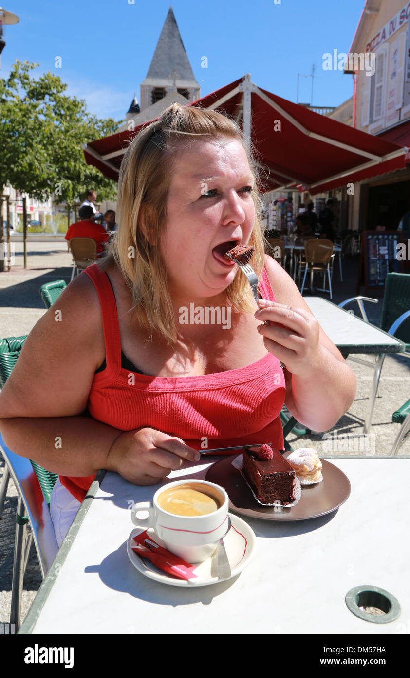 fat-woman-eating-cake-DM57HA.jpg