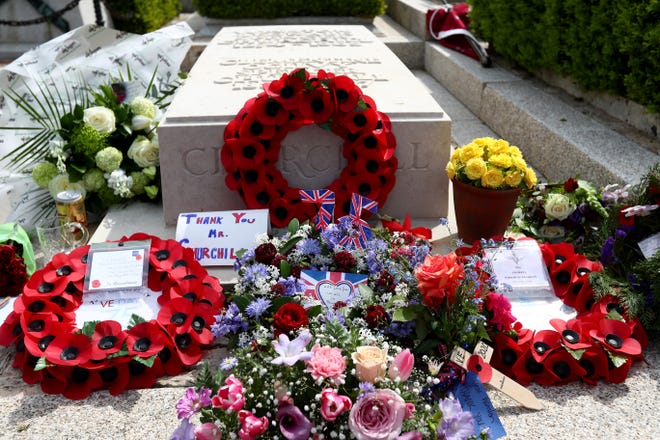 A detailed view of poppy wreaths and other tributes on the grave of Sir Winston Churchill in the cemetery of St Martin's Church on May 8, 2020 in Bladon, Oxfordshire, United Kingdom. 