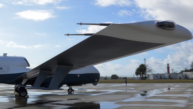 The MQ-4C Triton drone has a huge 130.9-foot wingspan, a Rolls-Royce AE3007H jet engine behind that tall intake on the back.